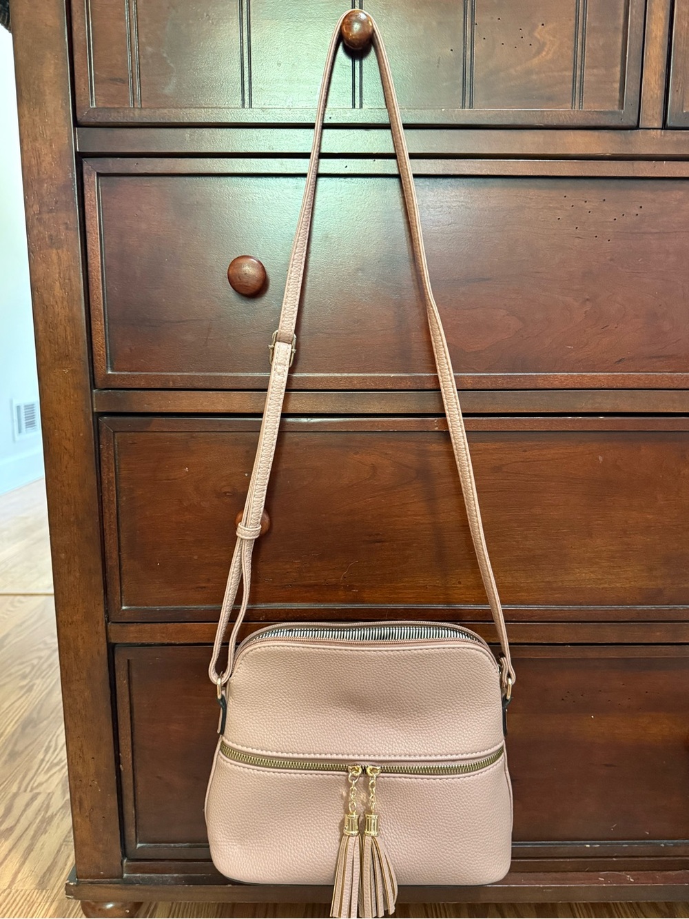 Women’s Blush Pink Crossbody Bag with Tassel Accents